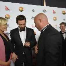 Hugh Jackman and Debra-Lee Furness receiving an ASA Gecko from Wayne Quilliam at the 2013 G’Day LA Red Carpet