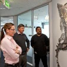 Wayne, Kent Beasley and Keana Hunter checking out the crocodile that was installed in their Brisbane office in early 2012